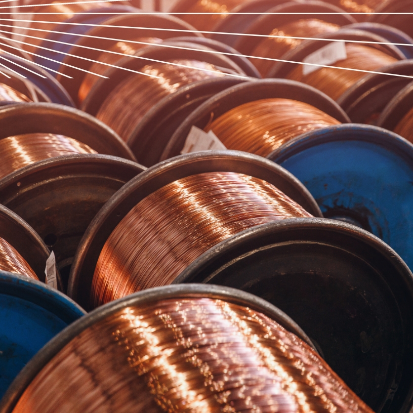 Close-up of reels of bare bright copper wire.